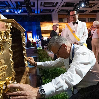Delegates venerate relics of the Mexican Martyrs after the Memorial Mass of the 142nd Supreme Convention on Aug. 8 in Québec City. The Order’s Christ the King reliquary contains relics from 25 saints and 13 blesseds — including six Knights — who were martyred in Mexico in the 1920s and ’30s.