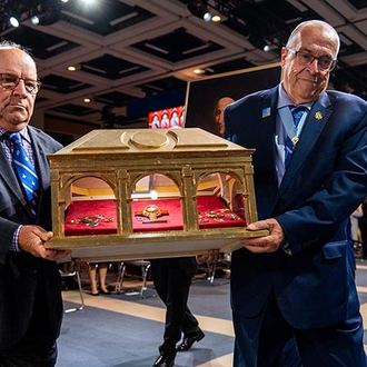 Leaders with the Québec State Council process into the Memorial Mass with relics of more than 20 saints and blesseds of Canada, including St. Jean de Brébeuf and St. Marguerite Bourgeoys. The reliquary belongs to the Archdiocese of Québec.