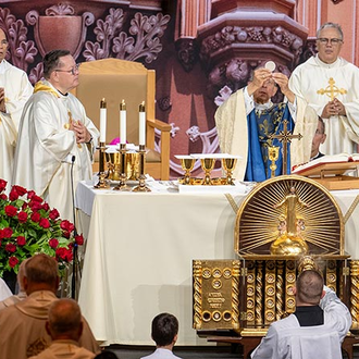 Supreme Chaplain Archbishop William Lori elevates the Eucharist during the Memorial Mass of the 142nd Supreme Convention on Aug. 8 in Québec City.