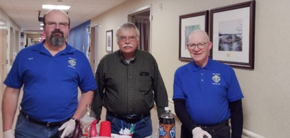 From left, Grand Knight Mark Stauber, Luis Willis and Terry Verville of Iron River (Mich.) Council 2300 deliver “black cows” (root beer floats), sundaes and other treats to residents, visitors and staff at the Iron Mountain VA Medical Center. Council 2300 organizes this Black Cow event at the center every three months.