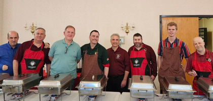 Members of St. Matthew Council 14360 in Norwalk, Conn., stand ready to serve food during the council’s 11th Annual Columbus Day Italian Supper. 