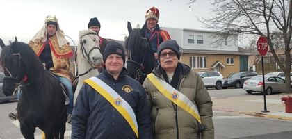 Members of Mater Christi Council 14284 in Chicago prepare to lead St. Ferdinand Church’s annual Three Kings Parade after Mass on Epiphany. 