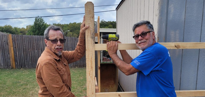 Hector Rubio (left) and Jesus Radillo of Holy Spirit Council 8157 in Duncanville, Texas, repair a local home’s fence as part of the council’s Knights Hands program — the 500th project completed through the program.