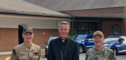U.S. Navy Lt. Joel Haas (left) and Capt. Bill Dull, members of St. Francis of Assisi Council 16356 at Naval Submarine Base Kings Bay, Ga., stand with Bishop Stephen Parkes of Savannah before a pilgrimage from the base’s St. Francis of Assisi Chapel to Our Lady, Star of the Sea Church in St. Marys. About 250 people participated in the pilgrimage, organized by Council 16356 and St. Marys (Ga.) Council 11058, to pray for vocations in the Diocese of Savannah and the Archdiocese for the Military Services, USA.