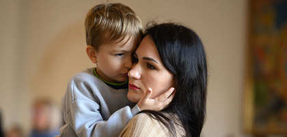 Mother holding her son.