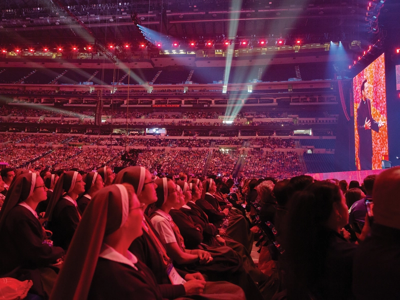 A crowd of more than 50,000 people listens as Father Mike Schmitz delivers a keynote address.