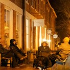 Knights gather on benches along Main Street in Nantucket, Mass.