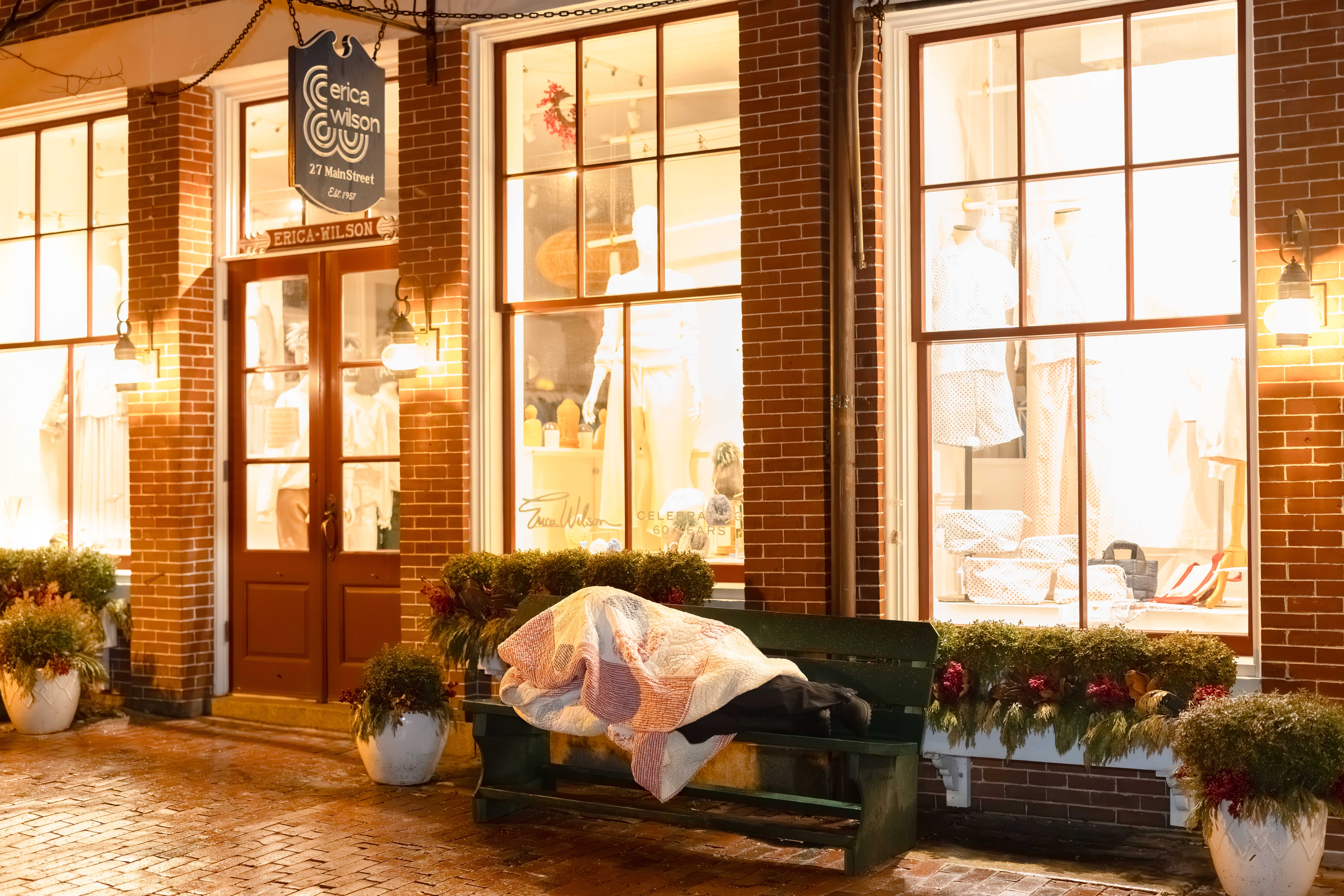 A member of T.J. McGee Council 2612 sleeps on a bench along Main Street in Nantucket, Mass.