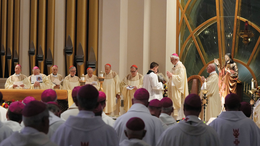 Archbishop Paul S. Coakley of Oklahoma City leads bishops in consecrating the United States to the Sacred Heart of Jesus at the Basilica of the National Shrine of Mary, Queen of the Universe in Orlando, Fla.