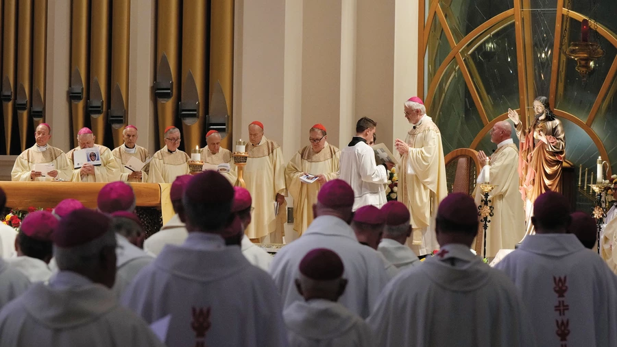 Archbishop Paul S. Coakley of Oklahoma City leads bishops in consecrating the United States to the Sacred Heart of Jesus at the Basilica of the National Shrine of Mary, Queen of the Universe in Orlando, Fla.