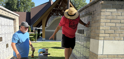 Knights from Father O’Byrne Council 3574 in Jacksonville, N.C., install stainless steel column and row numbers on the columbarium at Infant of Prague Catholic Church. Deacon James Marapoti, a brother Knight who requested the project, donated the steel numbers.