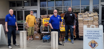 Knights from Marquette Council 588 in Sparta, N.J., assemble in front of a local grocery store to solicit donations for the council’s food drive.