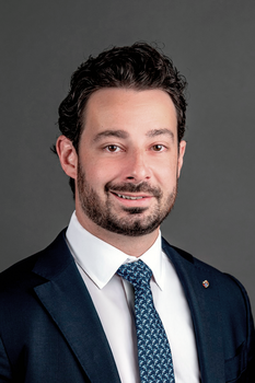 Headshot of Nicholas Gentile, Interim President & Chief Investment Officer, wearing a blue suit and tie