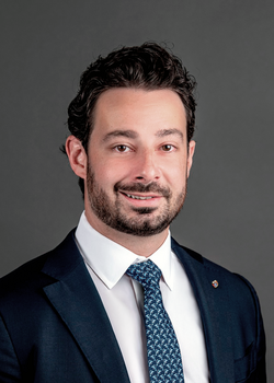 Headshot of Nicholas Gentile, Interim President & Chief Investment Officer, wearing a blue suit and tie
