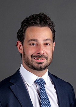 Headshot of Nicholas Gentile, Interim President & Chief Investment Officer, wearing a blue suit and tie