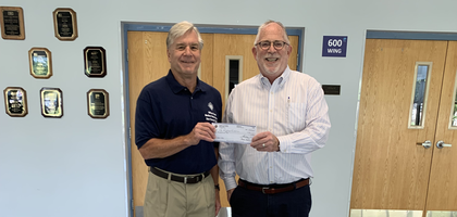 Michael Schuler (left), a member of Mother Seton Council 15540 in Three Bridges, N.J., presents a $500 check to Shawn McInerney, president and CEO of Midland School, a local special education school. The funds came from Council 15540’s fund drive for people with disabilities, which raised a total of $2,300. The rest of the funds were distributed as follows: $800 to The Arc of Somerset County, $500 to Special Olympics New Jersey, and $500 to Center School.
