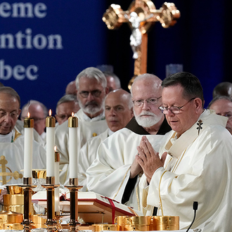 Cardinal Gérald Lacroix and his concelebrants, including Supreme Chaplain Archbishop William Lori, pray over the gifts during the Liturgy of the Eucharist during the opening Mass of the 142nd Supreme Convention in Québec City on Aug. 6.