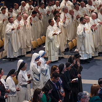 Concelebrating priests, religious sisters and Knights and their families pray during the opening Mass of the 142nd Supreme Convention in Québec City on Aug. 6.