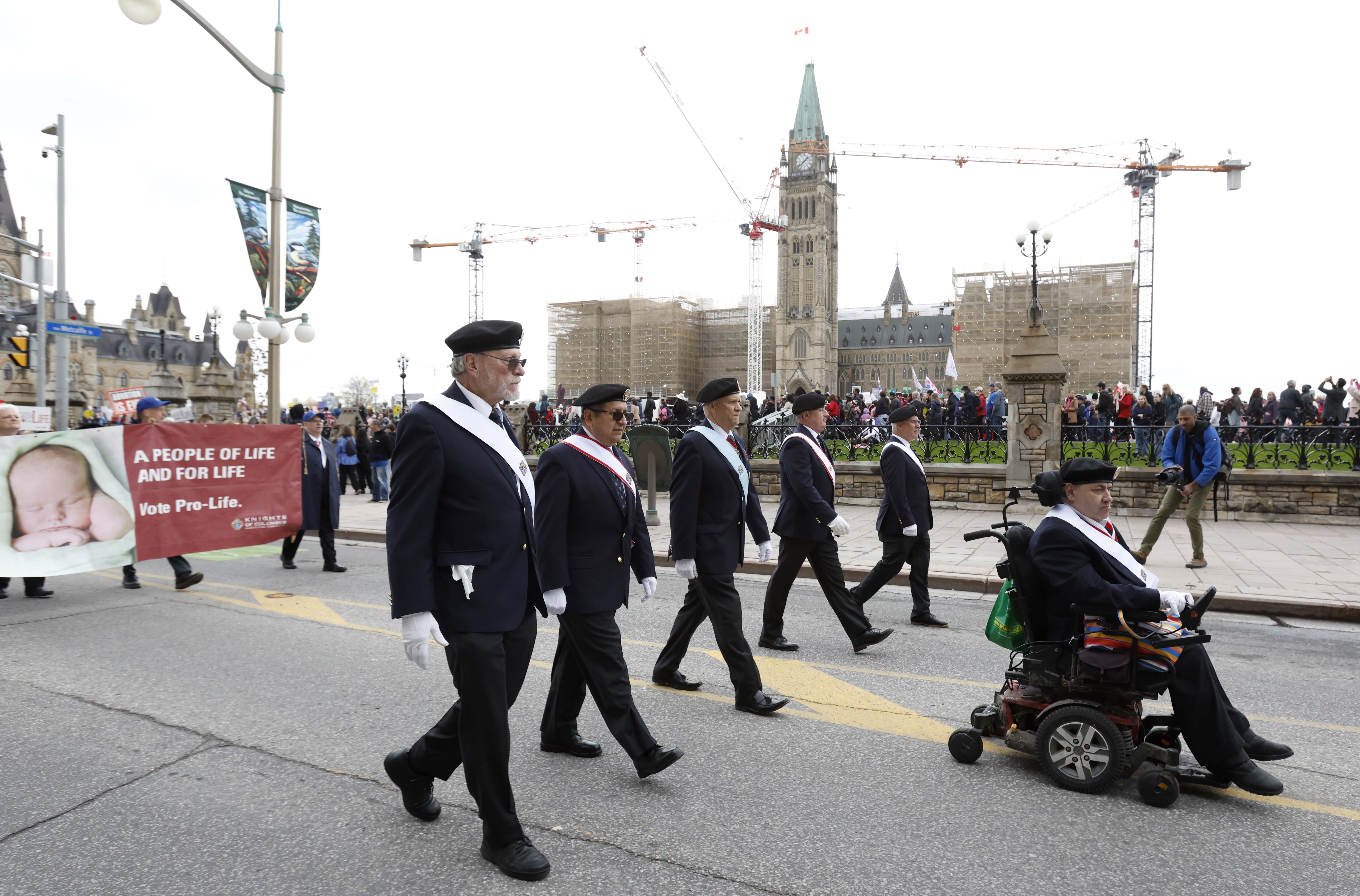 A Fourth Degree honor guard leads pro-life demonstrators past Parliament Hill during the 29th National March for Life in Ottawa, Ontario.