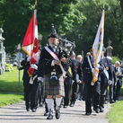 Bagpiper Donald MacDonald, past grand knight of St. Patrick’s Basilica Council 485, leads a Fourth Degree honor guard through Notre Dame Cemetery