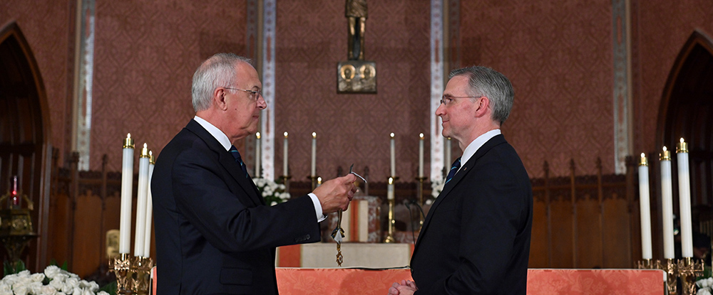 Past Supreme Knight Carl Anderson confers the medal of office on Supreme Knight Patrick Kelly.