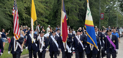 A color guard from St. Mary Magdalene Assembly 2517 in Humble, Texas, leads the annual Fourth of July parade in Kingwood. Assembly 2517 has participated in the parade since 1998, and several associated councils participate as well. More than 11,000 people attended this year’s parade.