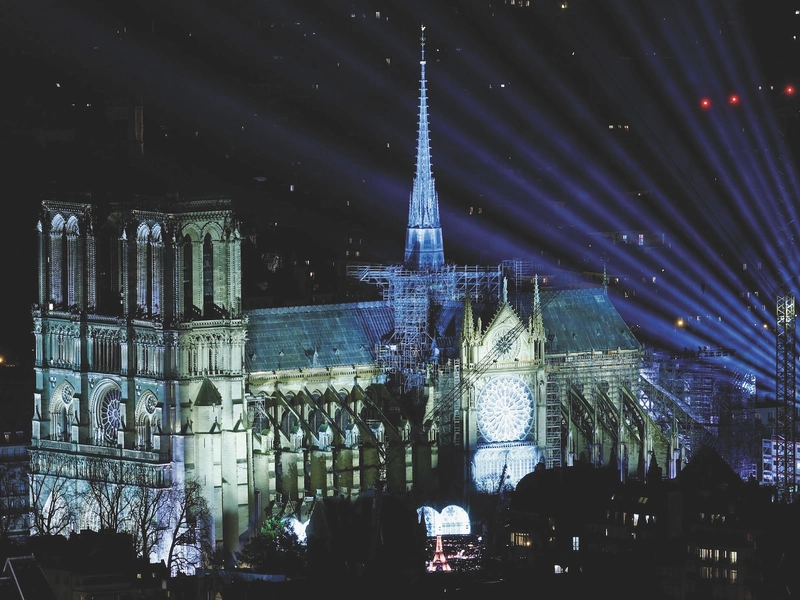 Notre-Dame Cathedral in Paris is arrayed in light during the reopening celebration.