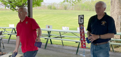 John Fitzpatrick (left), past grand knight of St. Joseph the Worker Council 10921, and Mark Wood, treasurer of Queenship of Mary Council 4050, play cornhole during the councils’ jointly hosted second annual cornhole fundraiser tournament at Memorial Park in Egypt, Pa. About 150 people attended, with 40 participating in the tournament. 
