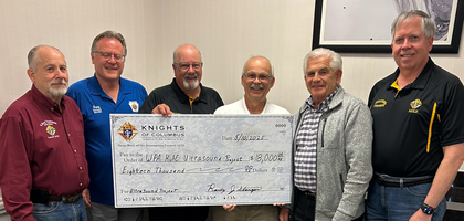 Knights from St. Mary of the Assumption Council 14722 in Glenshaw, Pa., present an $18,000 check for the purchase of a machine for Women’s Choice Network. The $18,000 came from private donations and breakfast fundraisers hosted by Council 14722 at St. Mary of the Assumption Church and St. Ursula Church.