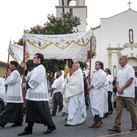 Archbishop José Gomez of Los Angeles carries the monstrance from Sacred Heart Church, leading a Eucharistic procession through Altadena, Calif., on June 20. 