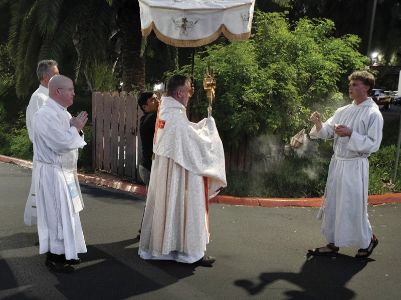 Stephen Fuhrmann (right), a member of Lindsay (Texas) Council 11905, incenses the Blessed Sacrament during a Eucharistic procession at Mission San Diego de Alcal&aacute; in San Diego