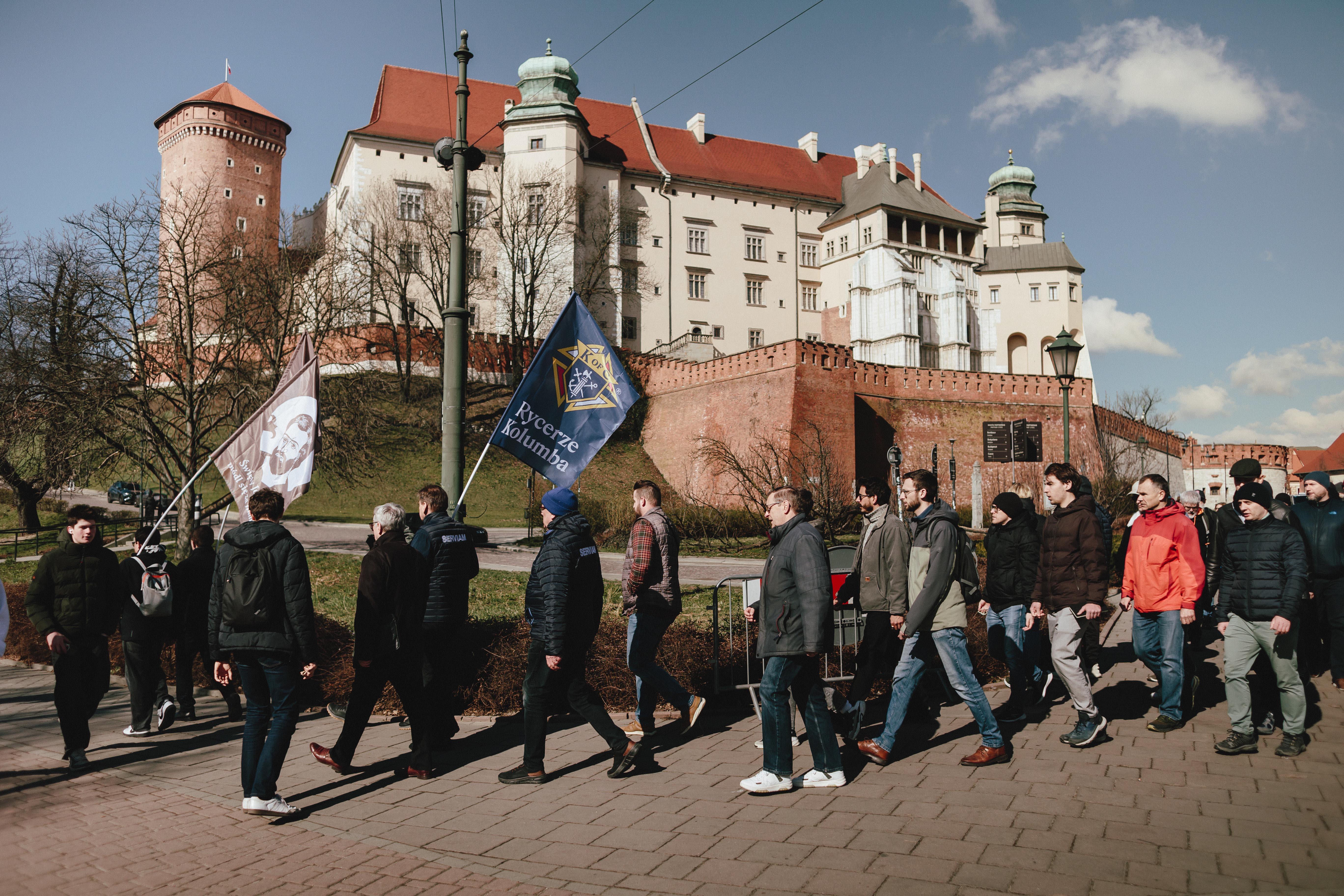 Knights walk past Wawel Royal Castle during the St. Joseph March in Krakow, Poland.