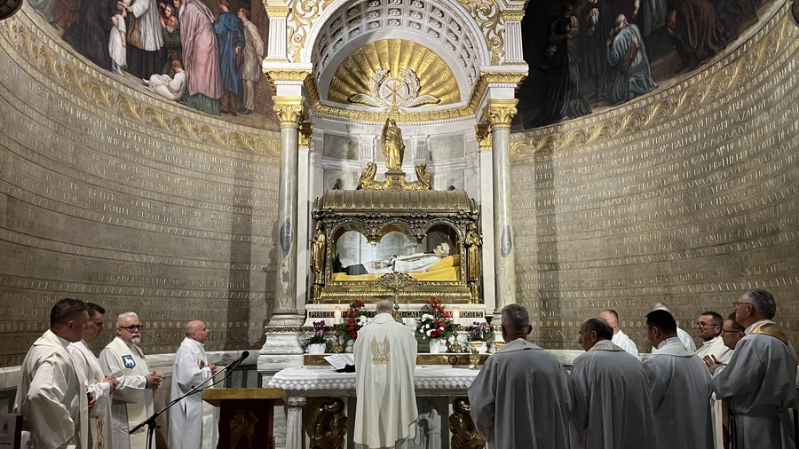 Polish Knights of Columbus chaplains celebrate Mass at the tomb of St. John Vianney at the Basilica of Ars in Ars-sur-Formans, France.