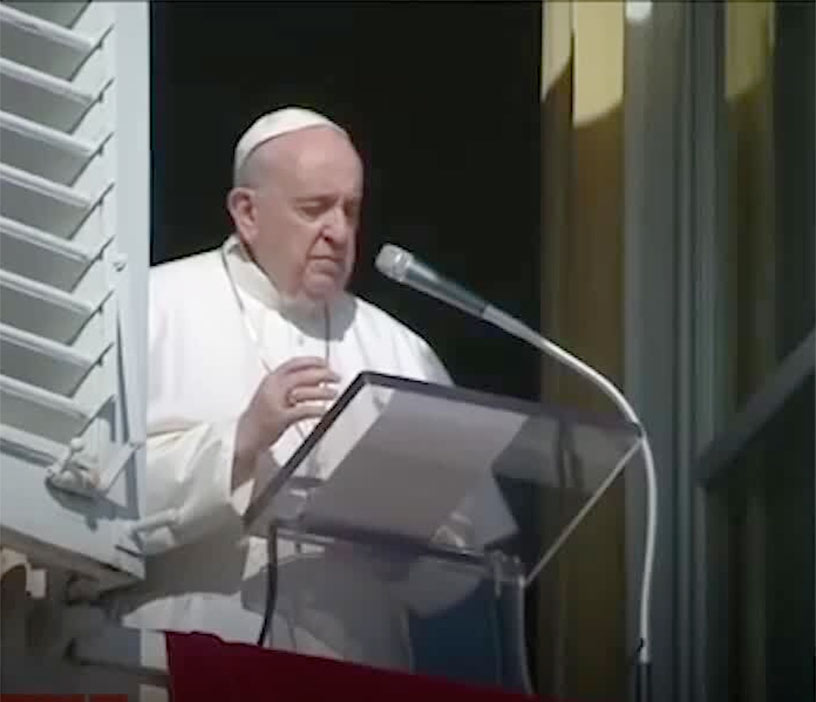 Pope Francis at a podium.