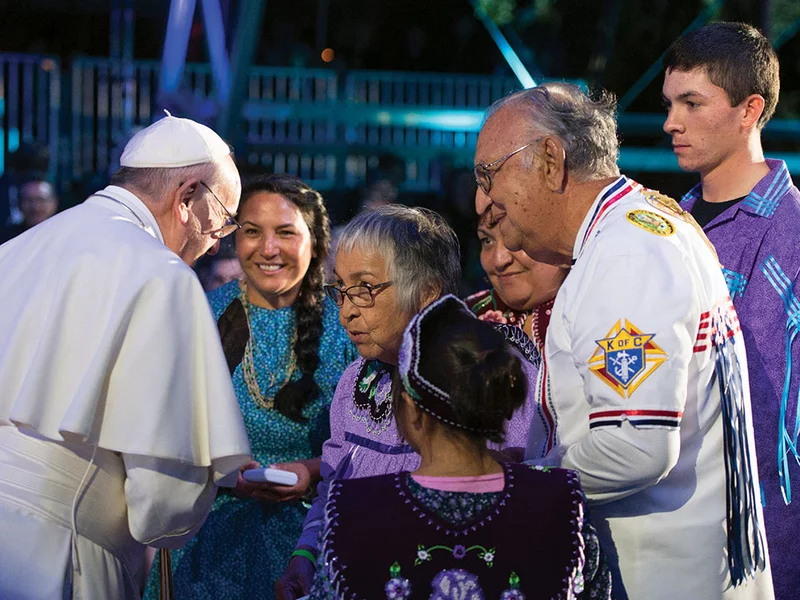 Rudy and Leona Gonzales, together with some of their children and grandchildren, speak with Pope Francis