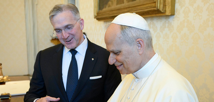 Supreme Knight Kelly presents Pope Leo XIV with a photo of the tank-landing ship the pontiff’s father served on during World War II.