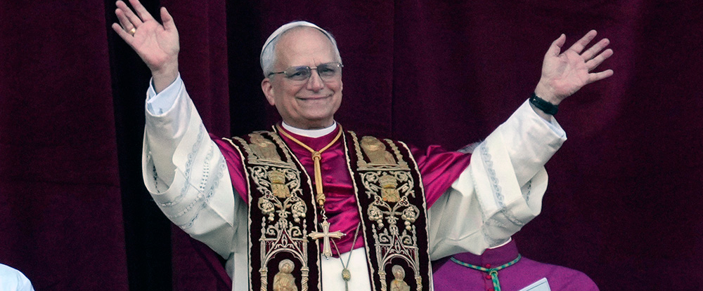 Pope Leo XIV greets the crowd from the central balcony of St. Peter’s Basilica after his election at the Vatican May 8. (Photo by Paul Haring) 