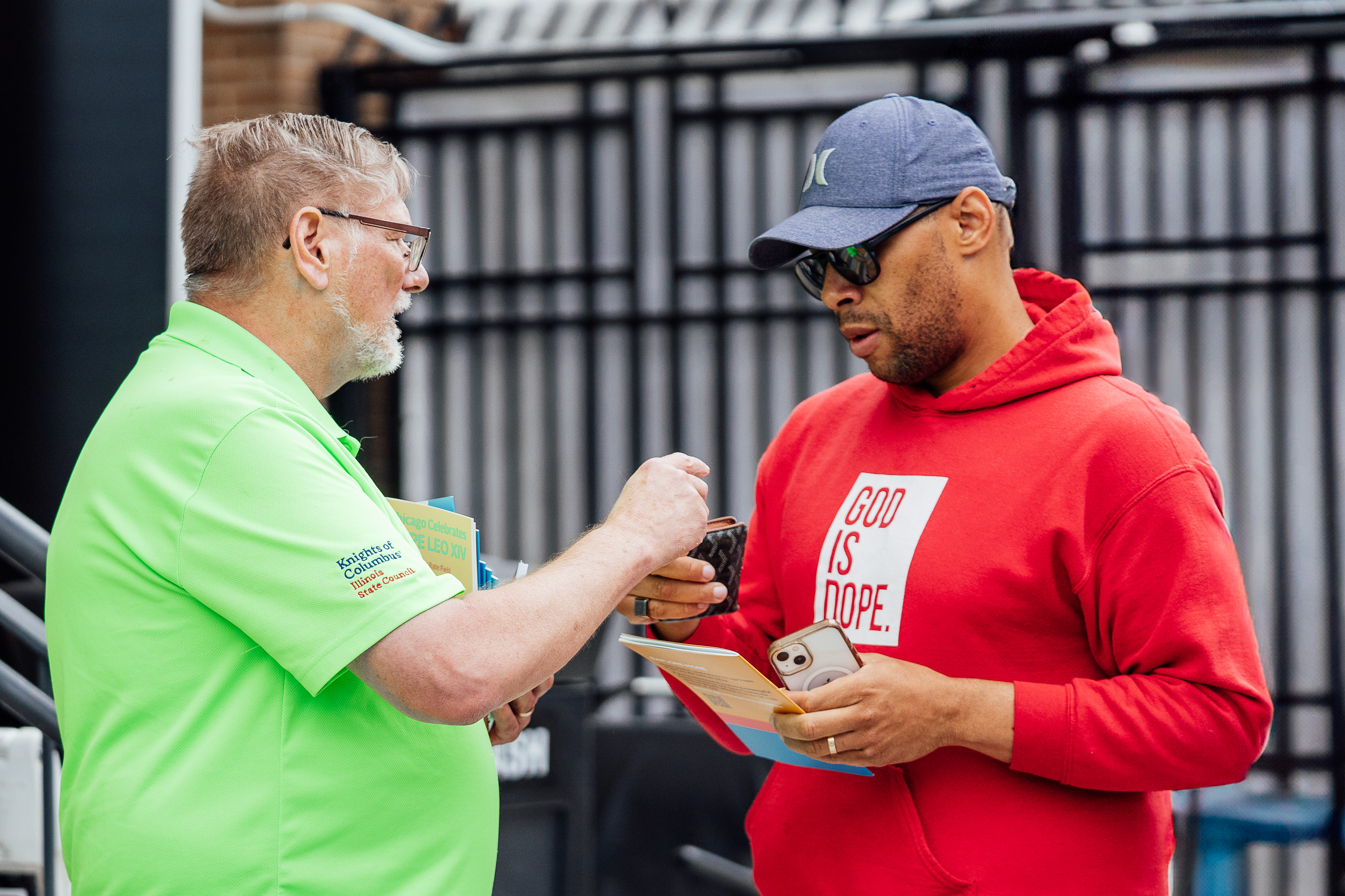 State Deputy Jeff Peters greets a man arriving to Rate Field