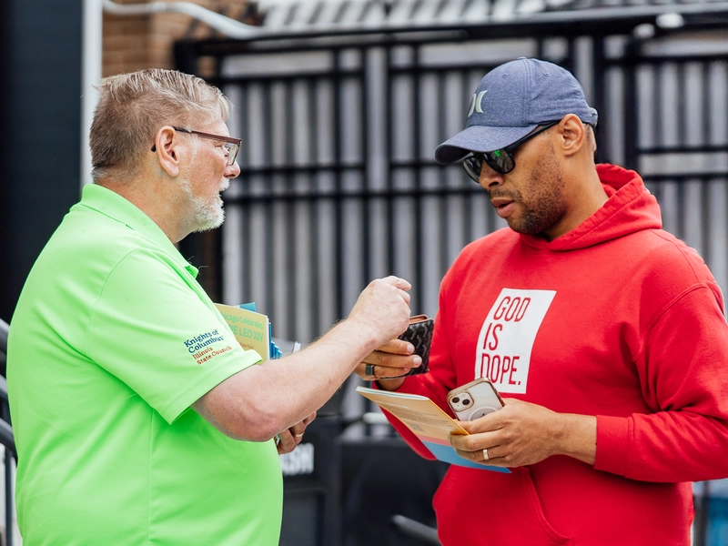 State Deputy Jeff Peters greets a man arriving to Rate Field