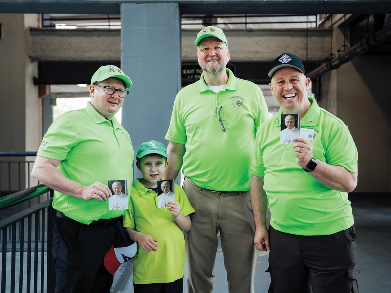 Illinois Knights of Columbus display prayer cards they distributed before the Pope Leo celebration
