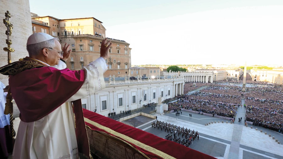 Pope Leo XIV waves to the crowd in St. Peter’s Square following his election as pope May 8.
