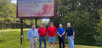 Knights from Our Lady of the Lake Council 13752 in Pocono Pines, Pa., stand in front of a billboard commissioned by the council as part of its ongoing pro-life campaign. With donations from several area councils and parishioners of St. Maximilian Kolbe Parish, Council 13752 has sponsored 25 billboards near high schools and colleges in northeast Pennsylvania — each displaying pro-life messages to educate passersby and to direct pregnant women in need toward local pregnancy resource centers. The council also donated $1,200 to the Pregnancy Resource Center of the Poconos.