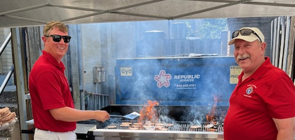 Deputy Grand Knight Harlen Seidel (right) and Mitch Musgrave of Father John J. McCarthy Council 12472 in Charleston, S.C., grill hamburgers and hot dogs for 120 students and others attending the Matthew 25 Project — a weeklong camp organized by Deacon Jerry White, a brother Knight, for high school students — at Bishop England High School. The camp encourages young people to be active in their community by participating in local service projects, faith formation, worship and fellowship.