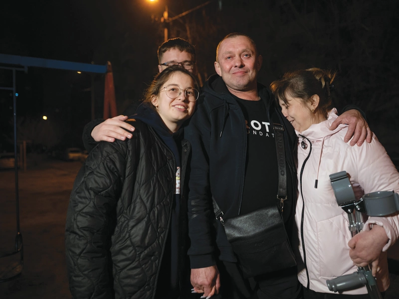 Viktor Openko with his family after returning home to Ukraine from Minnesota.