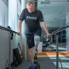 Viktor Openko exercises with his new prosthetic leg at the Protez Foundation’s rehabilitation center in Oakdale, Minn.