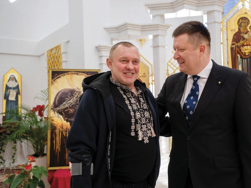 Ukraine State Deputy Mykola Mostovyak greets Openko at St. Basil the Great Church in Kyiv.