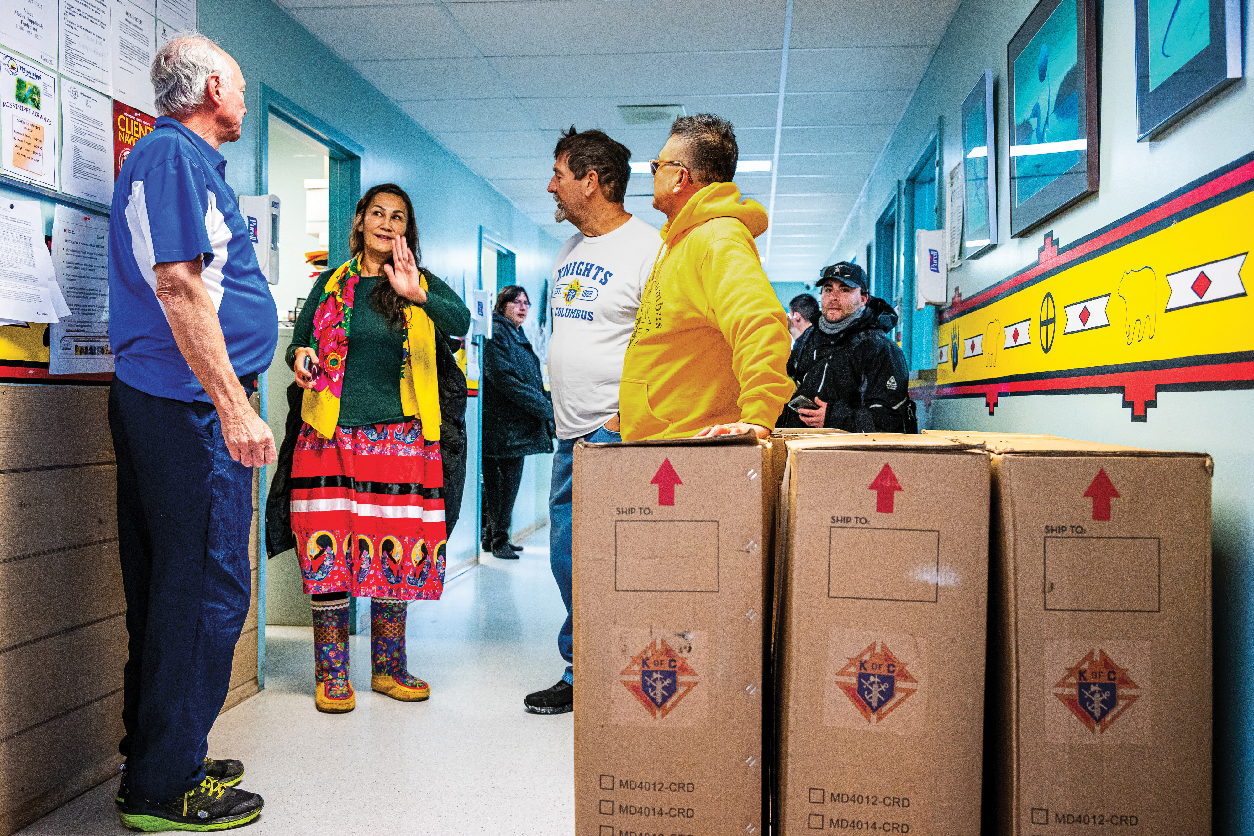 A councillor for the Mathias Colomb Cree Nation speaks with Knights at Nikawiy Health Nursing Station.