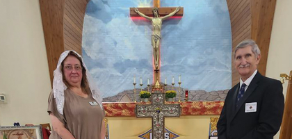 Paul Petro, treasurer for the Idaho State Council, and his wife, Bonnie, gather around the reliquary of six Mexican martyrs — all priests and Knights of Columbus — after a Mass at Our Lady of Good Counsel Catholic Church in Mountain Home. Father D.L. McElligott Council 3703 hosted the reliquary at the church for a day, during which more than 60 people venerated the relics after Mass, a time of Eucharistic adoration and a rosary prayer service.