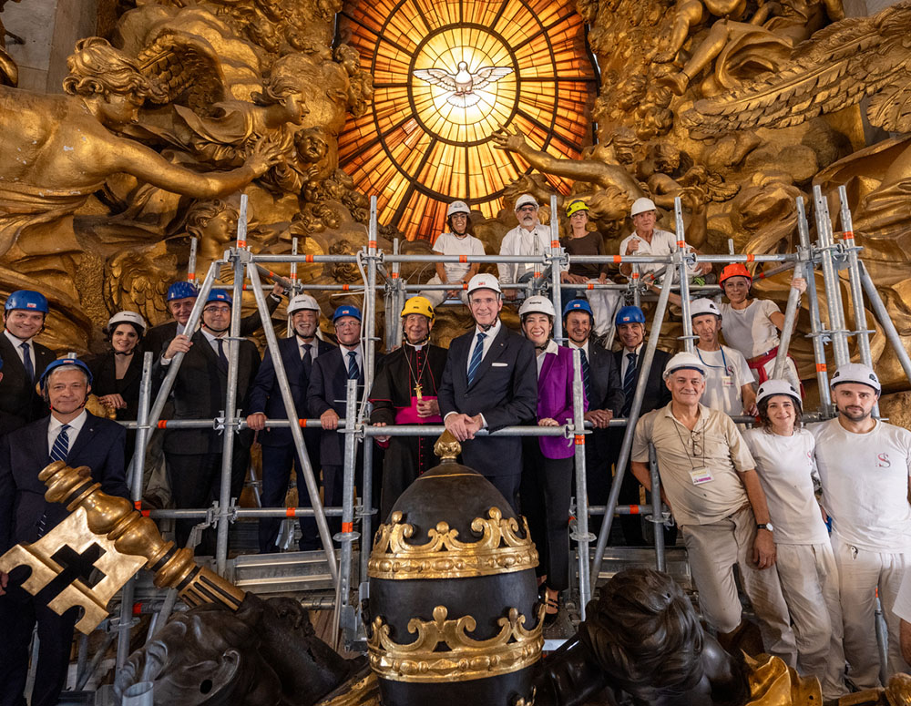 Supreme Knight Patrick Kelly, his wife, Vanessa, and other  KofC leaders gather at the top of the Altar of Chair of St. Peter with some of the experts who are now restoring the altar with support from the Knights. (Photo by Tamino Petelin&scaron;ek)