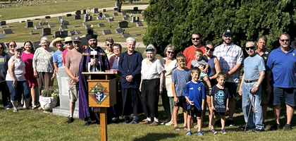 Members of Father Gilbert Carlton Council 9360 in Janesville, Wis., stand with parishioners of St. John Vianney Catholic Church at Mt. Olivet Cemetery’s memorial to unborn children after the council’s Rosary for Life prayer service. Council member Andrew Marcotte led over 25 people in praying the rosary, and Father Vince Racanelli, parochial vicar for St. Jane Parish and council chaplain, read Scripture and delivered a brief reflection. Council 9360 has organized the event for the past four years. 